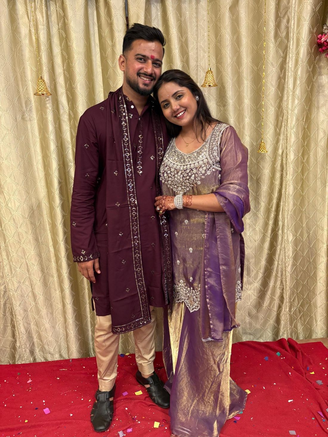 Krish and Chanchal smiling together in festive outfits