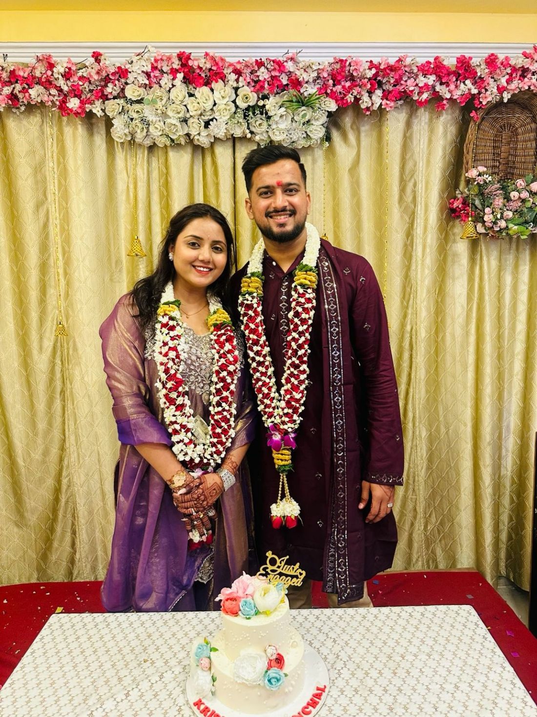 Krish and Chanchal wearing flower garlands